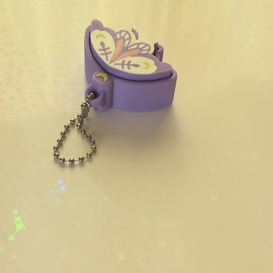 Pixie moth fidget clicker keychain 3D printed lavender with moon and botanical wing details pastel goth