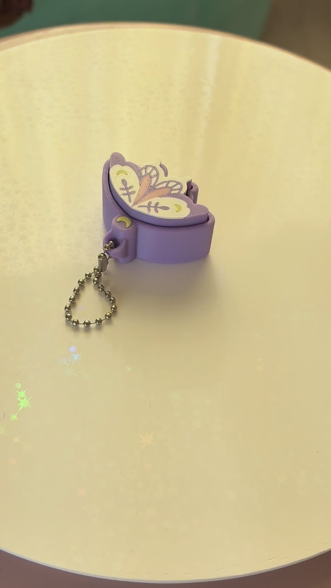 Pixie moth fidget clicker keychain 3D printed lavender with moon and botanical wing details pastel goth